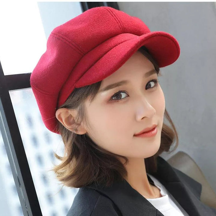 Octagonal newsboy cap with curved brim three-quarter front view