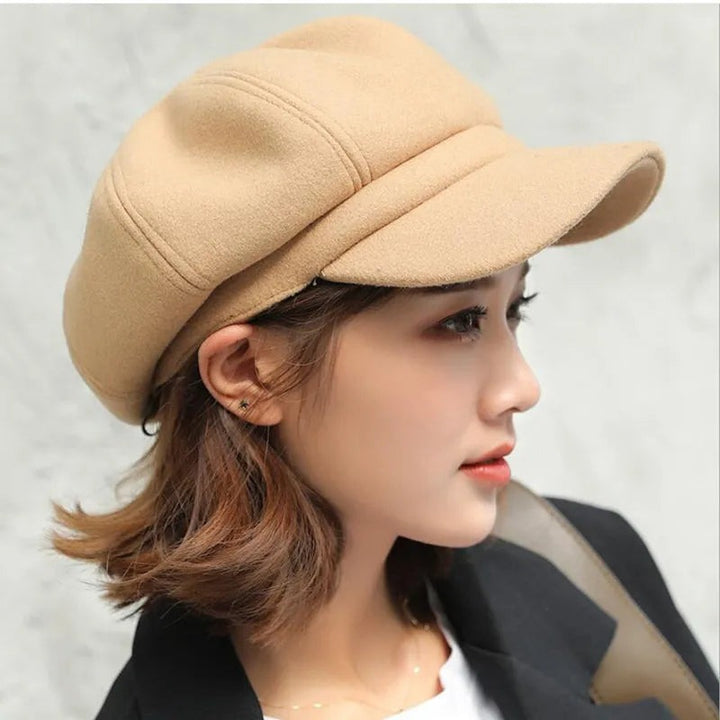 Felt-look newsboy cap with paneled crown side view