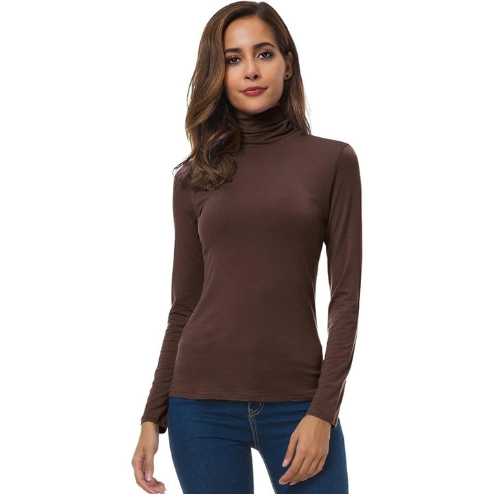 Fitted turtleneck top tucked into jeans front view