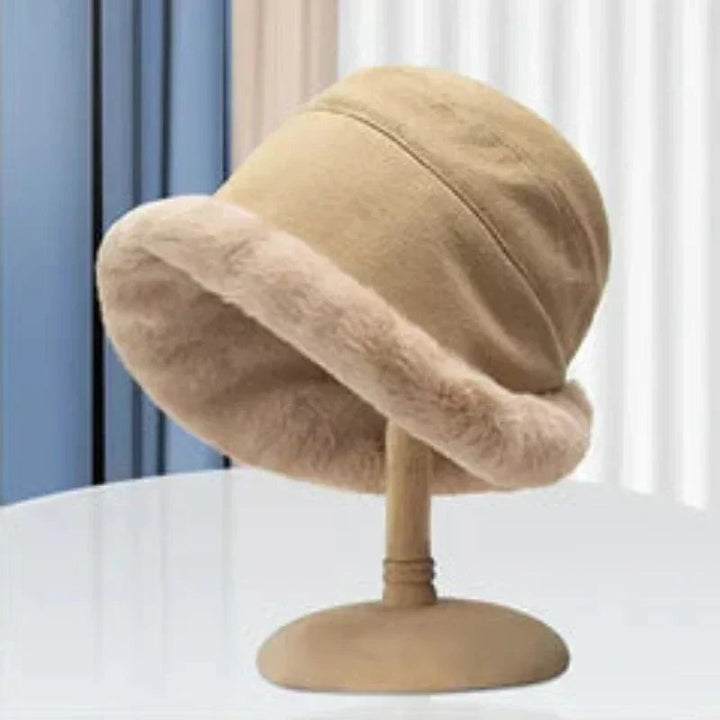 Faux fur trim bucket hat front view on stand
