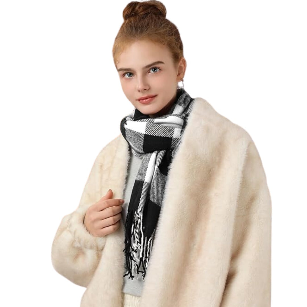 Check tassel scarf tucked into a coat collar front view