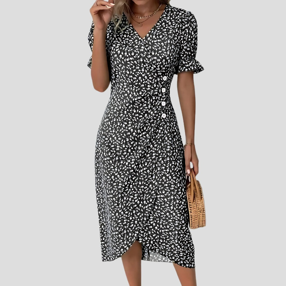 Women's Short Sleeve Printed Midi Dress with Button Side Wrap Hem shown in Black